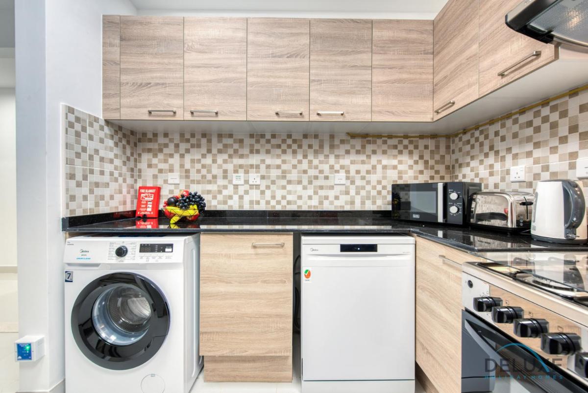 Vivid 2BR at Canal Residences West Dubai Sports City by Deluxe Holiday Homes