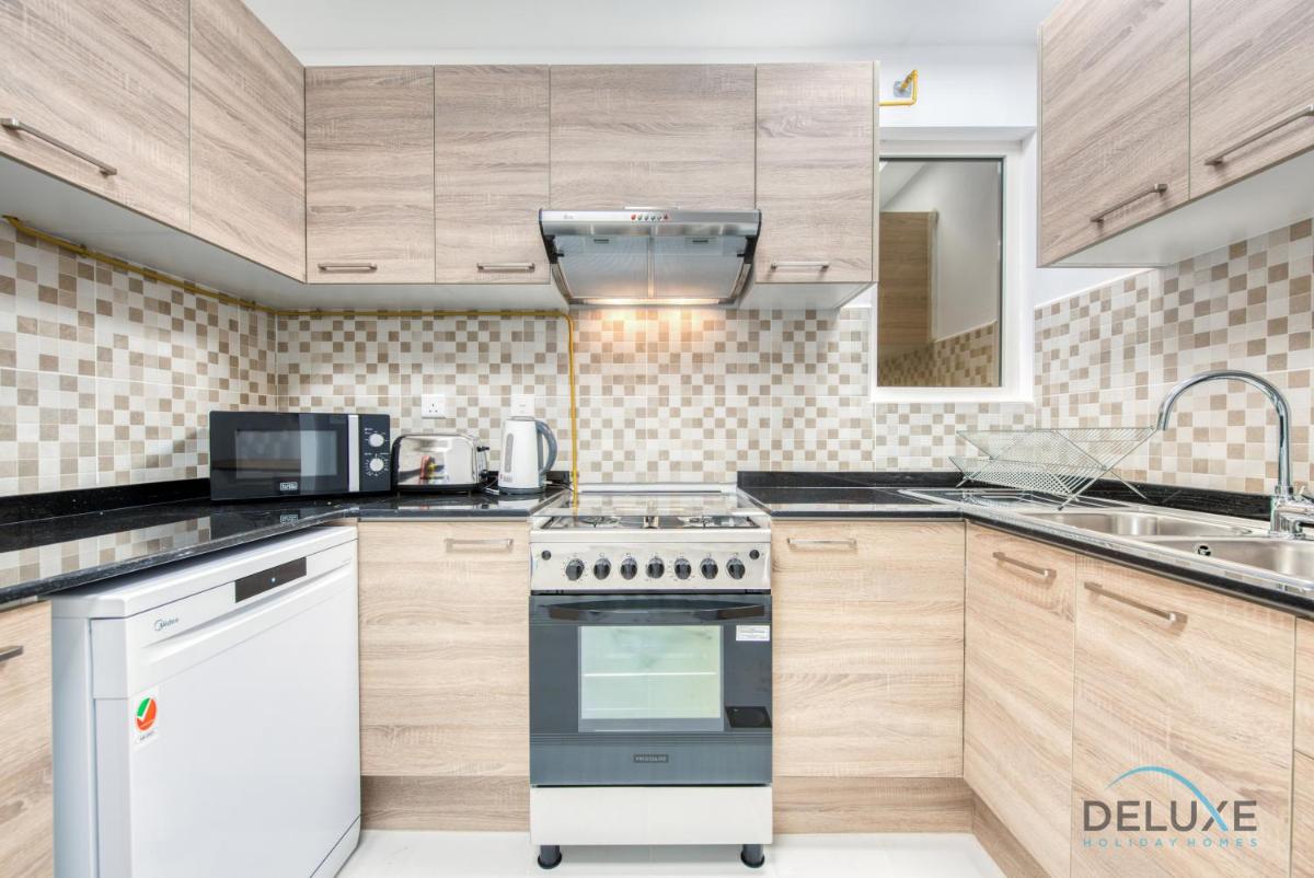 Vivid 2BR at Canal Residences West Dubai Sports City by Deluxe Holiday Homes