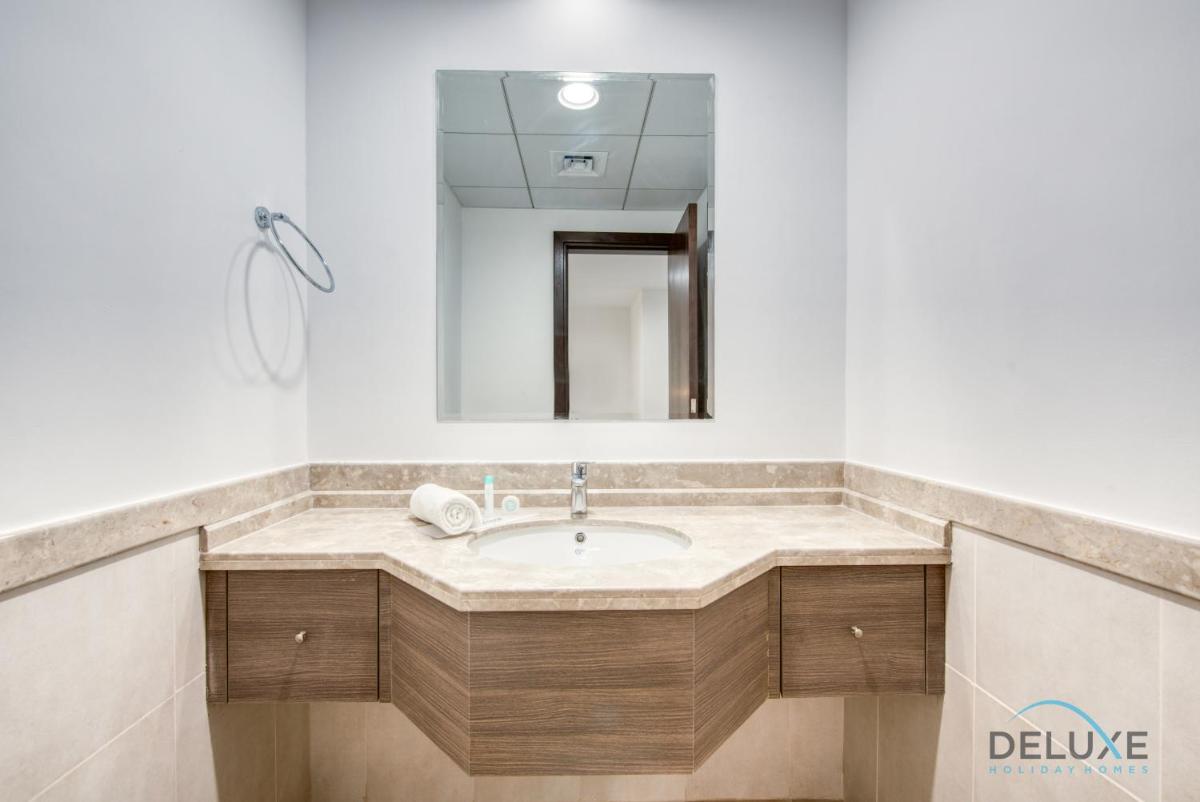 Vivid 2BR at Canal Residences West Dubai Sports City by Deluxe Holiday Homes