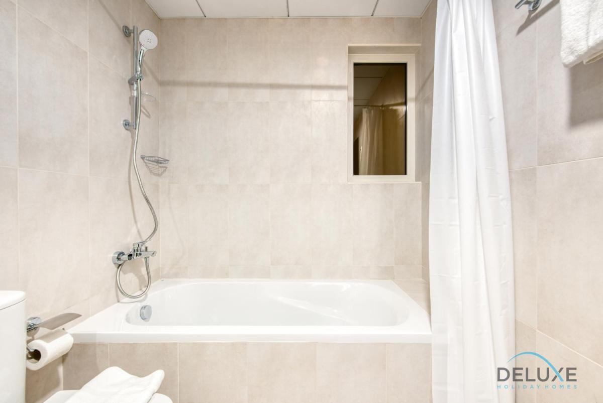 Vivid 2BR at Canal Residences West Dubai Sports City by Deluxe Holiday Homes