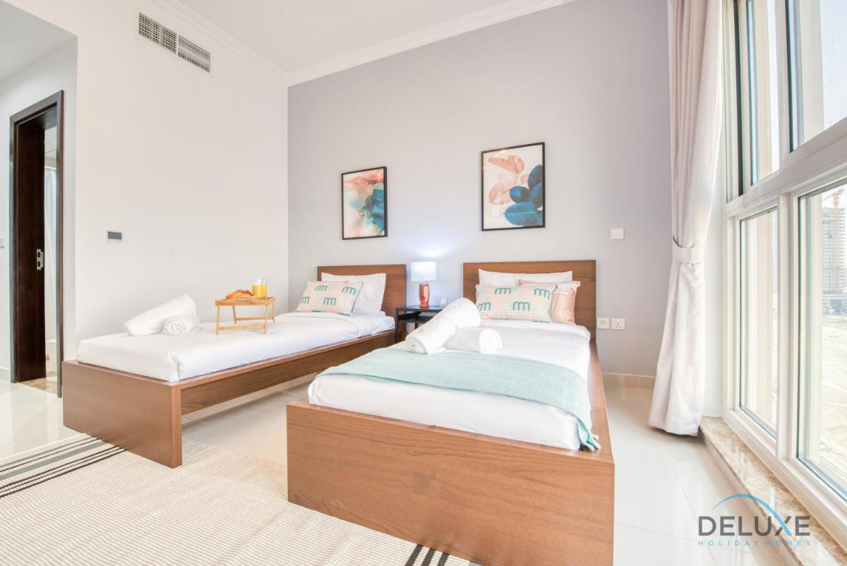 Vivid 2BR at Canal Residences West Dubai Sports City by Deluxe Holiday Homes