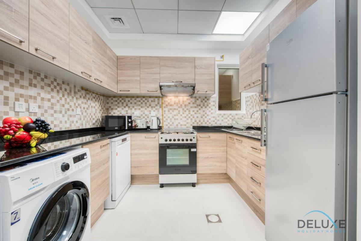 Vivid 2BR at Canal Residences West Dubai Sports City by Deluxe Holiday Homes