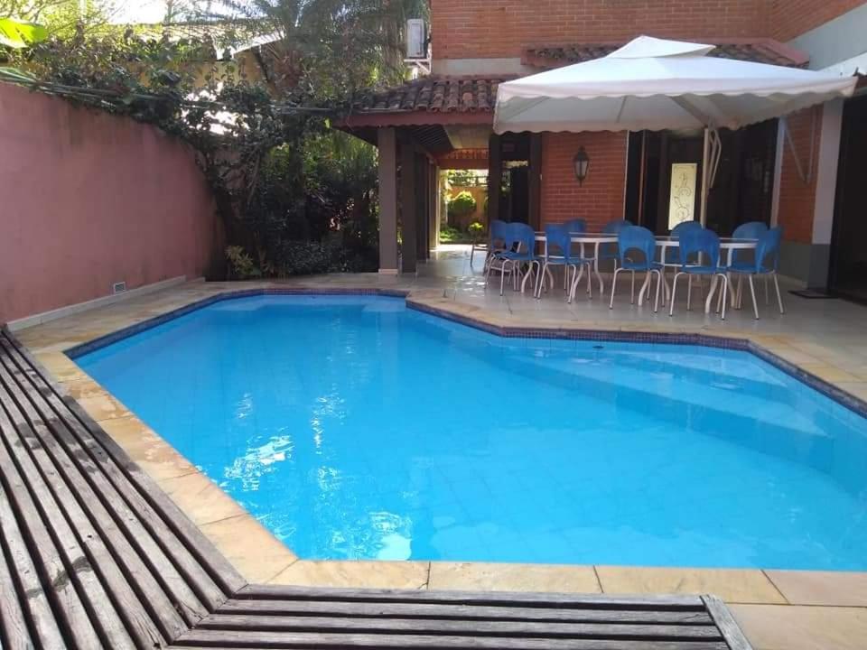 BEACH HOUSE Unidade 3 - Casas de Praia Guarujá 90 Metros do Mar 4suites ar condicionado Wi Fi Piscina
