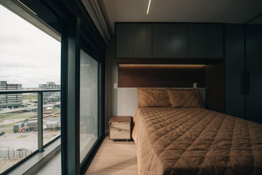 Loft com sacada, lareira e garagem no Parque Una