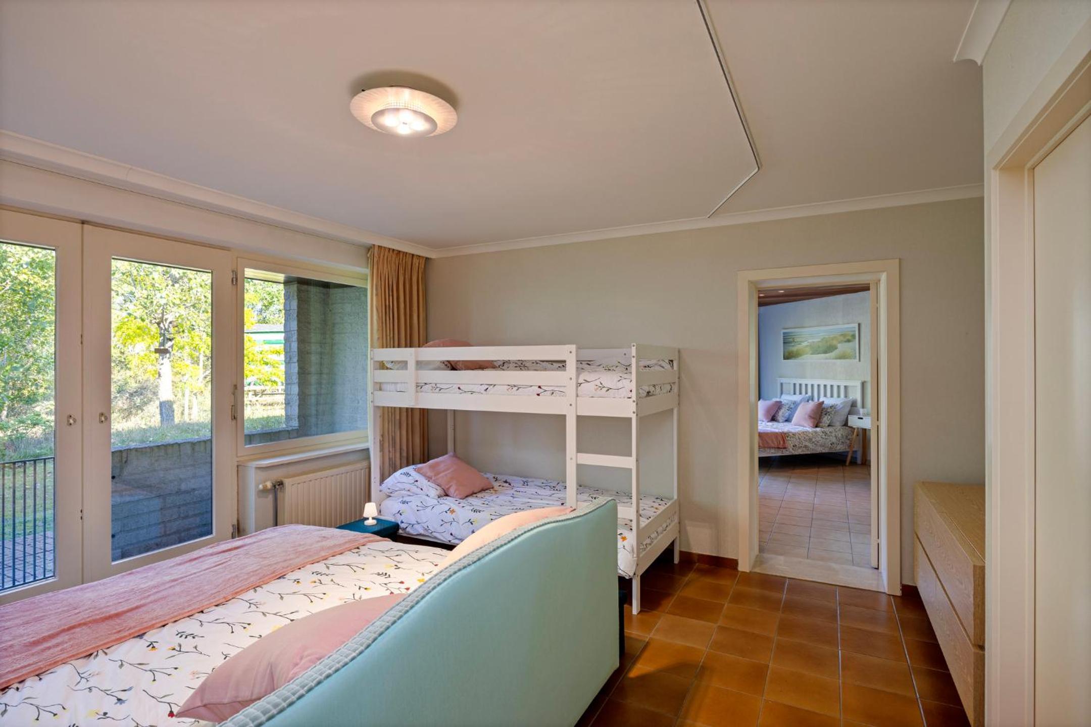 La Maison Fleurie - Sunny holiday home with large garden, parking, within walking distance of the sea