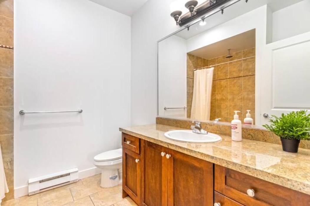 Private apartment with 2 bedrooms, 2 bathrooms, living area, laundry included