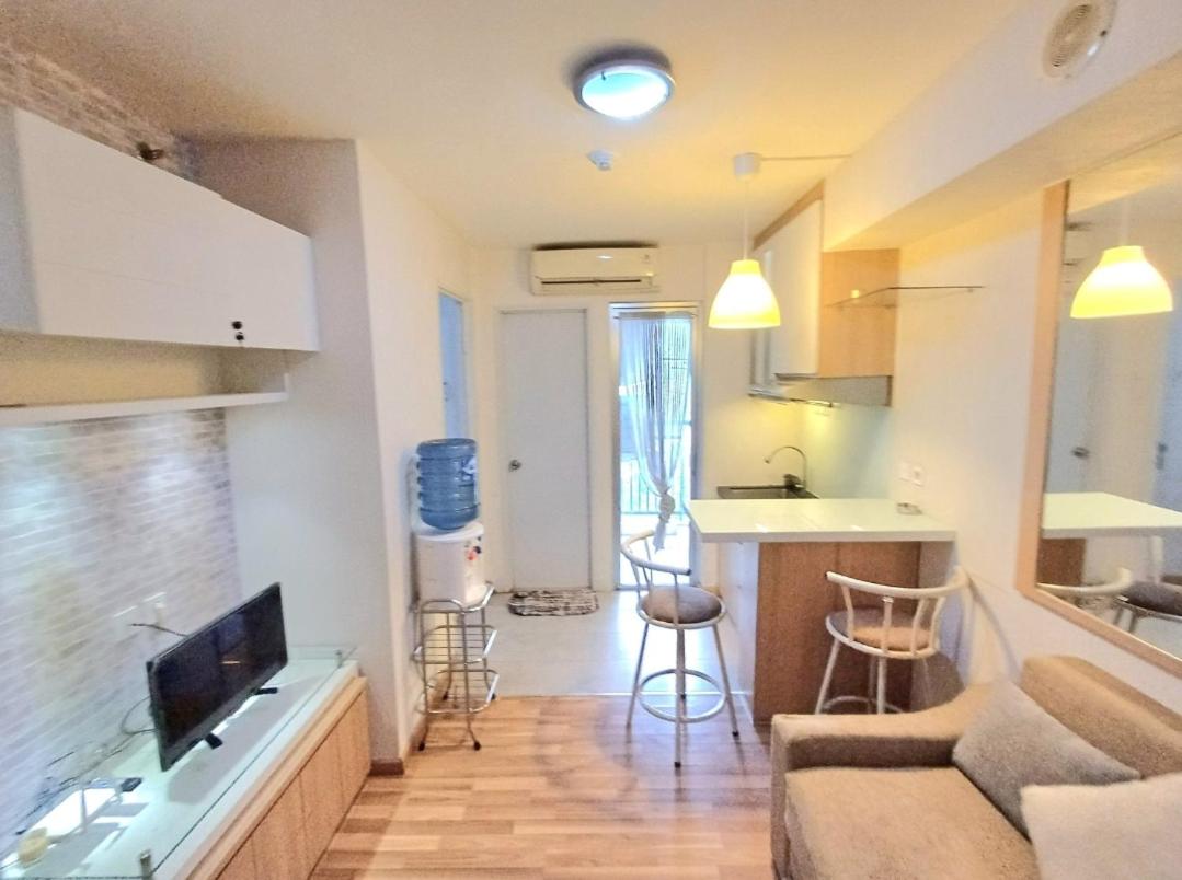 Bassura City Apartment by Sang Living view 5