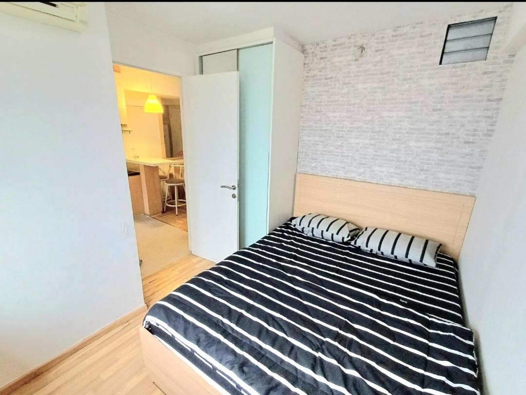 Bassura City Apartment by Sang Living view 2