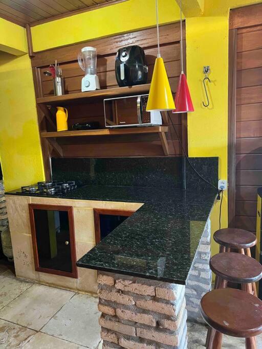 Casa amarela flecheiras