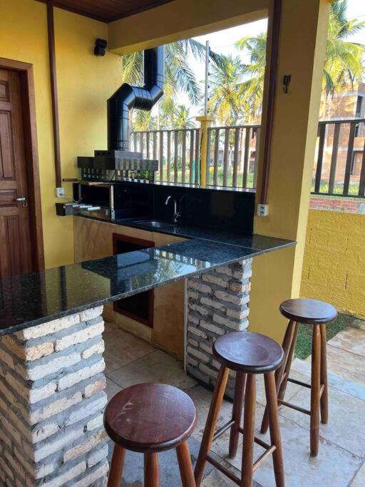 Casa amarela flecheiras