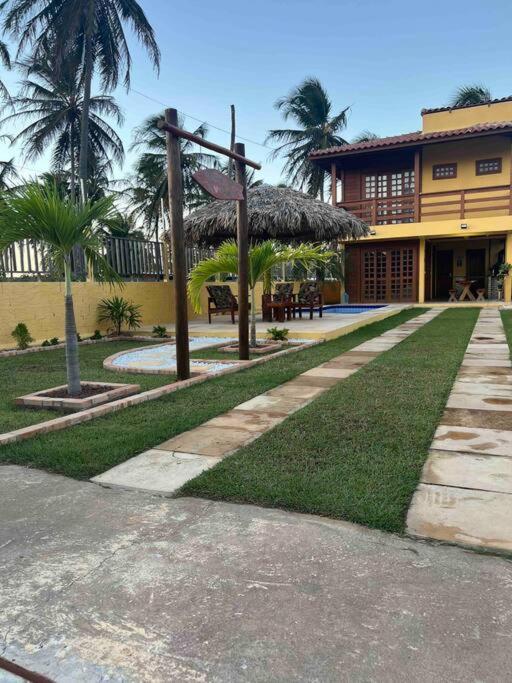 Casa amarela flecheiras
