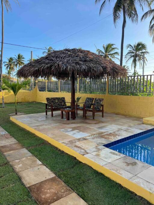 Casa amarela flecheiras