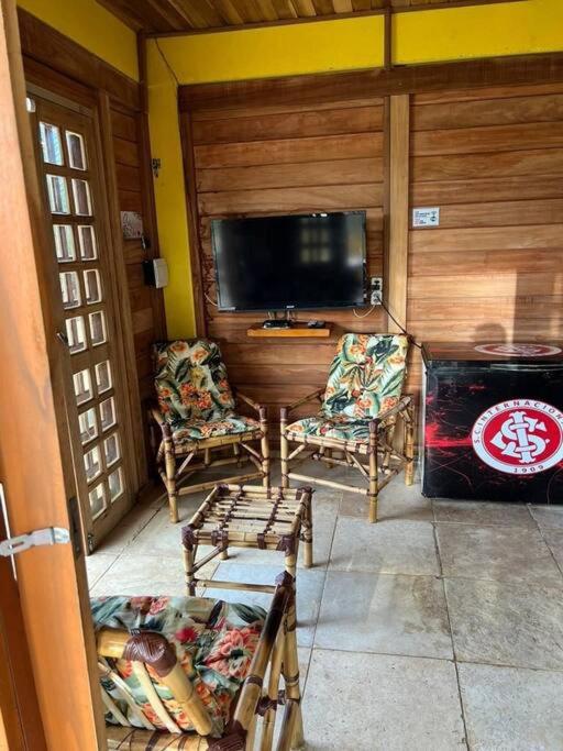 Casa amarela flecheiras