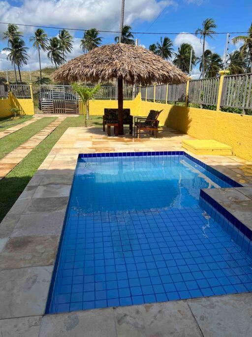 Casa amarela flecheiras