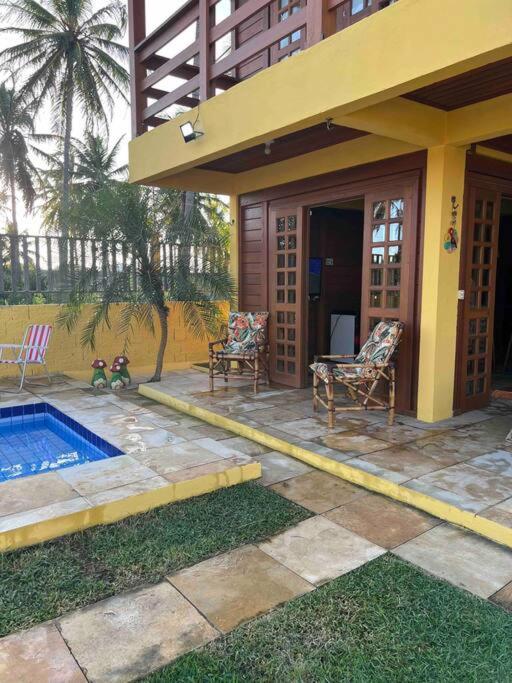 Casa amarela flecheiras