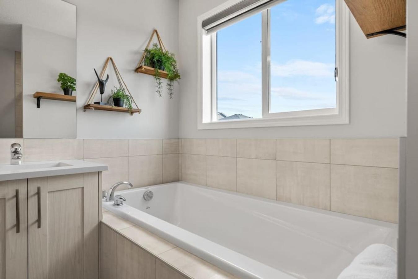 Top Rated Luxury House with Central AC, Double Garage Parking, 2 Kitchens, 5 Bedrooms & More!