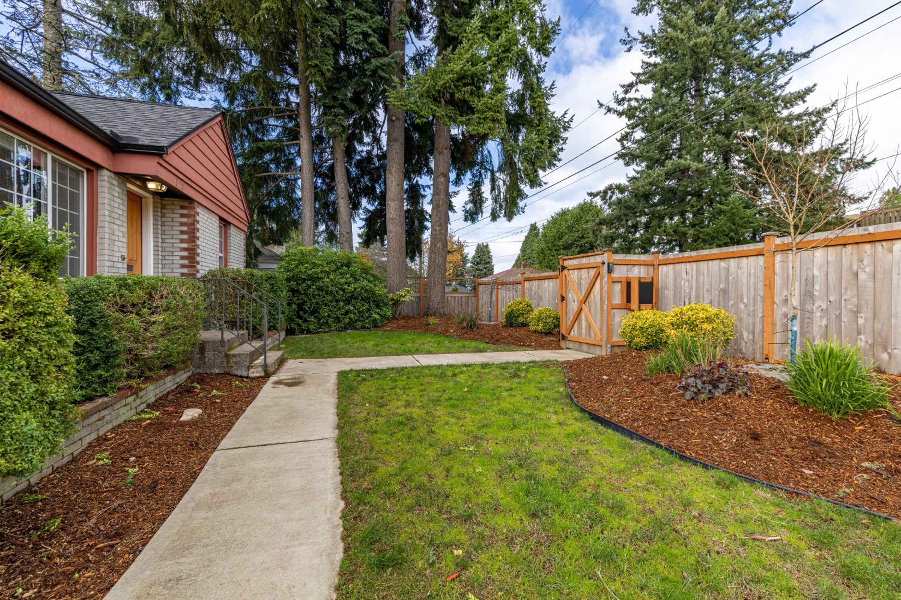 Remodeled Home Fenced Yard Outdoor Fireplace view 3