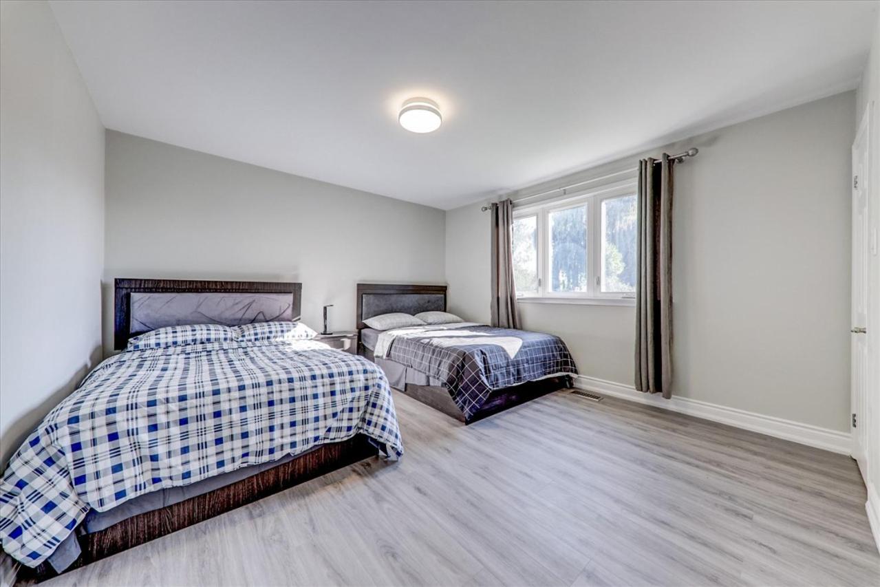 Stunning 7 Br RougeView Home with 2 Kitchens, 5 Bathrooms, Amazing Backyard & 8-Car Parking