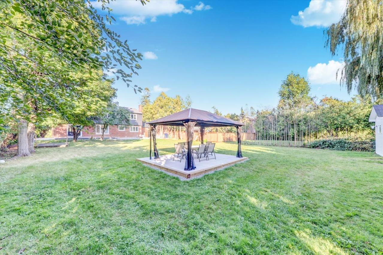 Stunning 7 Br RougeView Home with 2 Kitchens, 5 Bathrooms, Amazing Backyard & 8-Car Parking