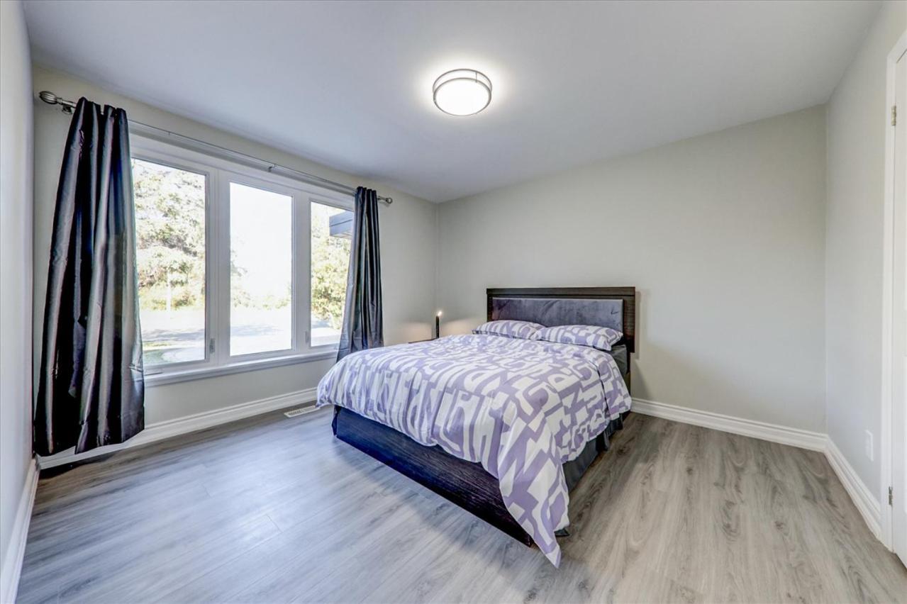 Stunning 7 Br RougeView Home with 2 Kitchens, 5 Bathrooms, Amazing Backyard & 8-Car Parking