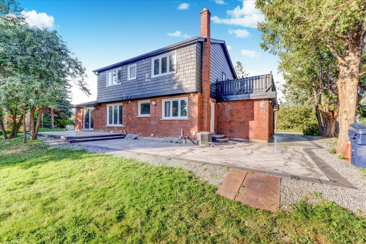 Stunning 7 Br RougeView Home with 2 Kitchens, 5 Bathrooms, Amazing Backyard & 8-Car Parking