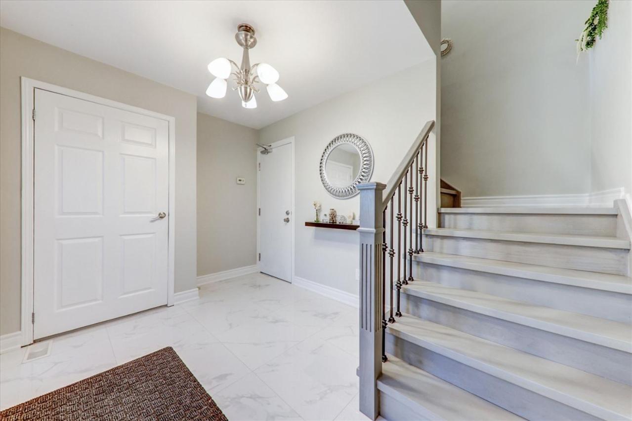 Stunning 7 Br RougeView Home with 2 Kitchens, 5 Bathrooms, Amazing Backyard & 8-Car Parking