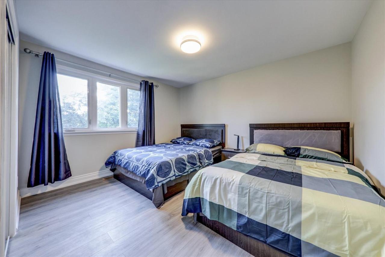 Stunning 7 Br RougeView Home with 2 Kitchens, 5 Bathrooms, Amazing Backyard & 8-Car Parking