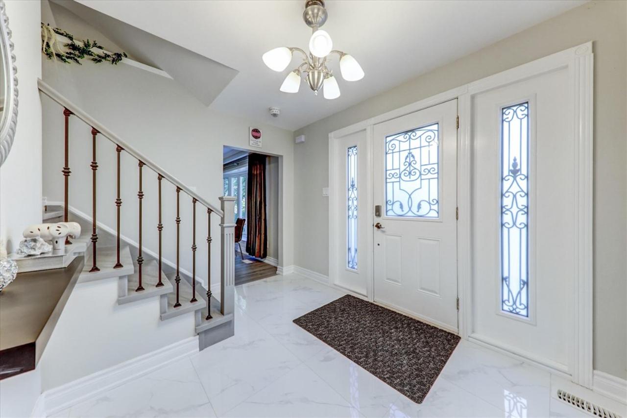Stunning 7 Br RougeView Home with 2 Kitchens, 5 Bathrooms, Amazing Backyard & 8-Car Parking