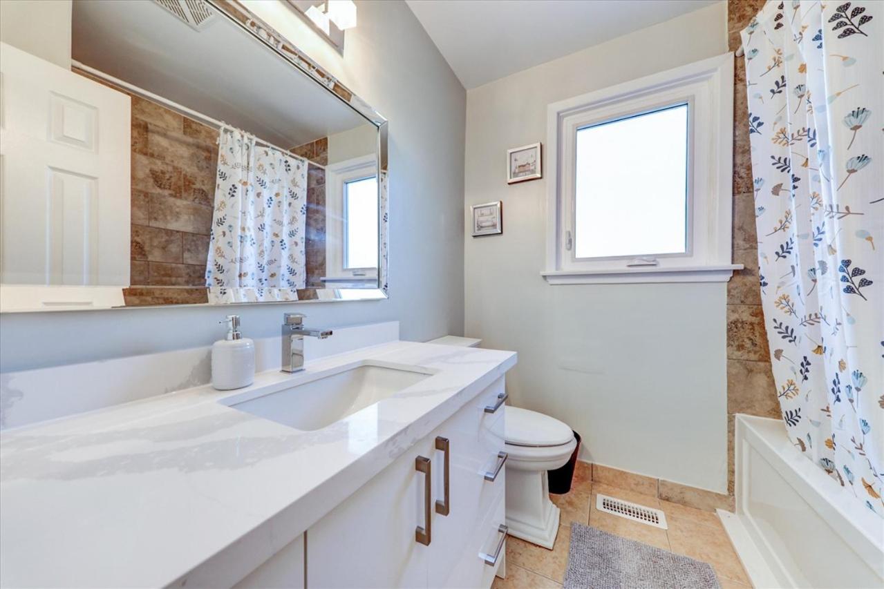 Stunning 7 Br RougeView Home with 2 Kitchens, 5 Bathrooms, Amazing Backyard & 8-Car Parking