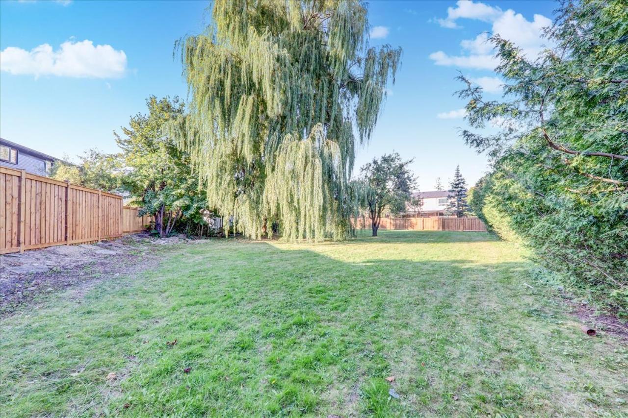 Stunning 7 Br RougeView Home with 2 Kitchens, 5 Bathrooms, Amazing Backyard & 8-Car Parking