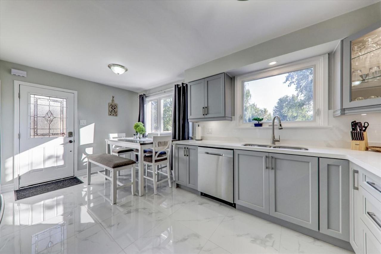Stunning 7 Br RougeView Home with 2 Kitchens, 5 Bathrooms, Amazing Backyard & 8-Car Parking