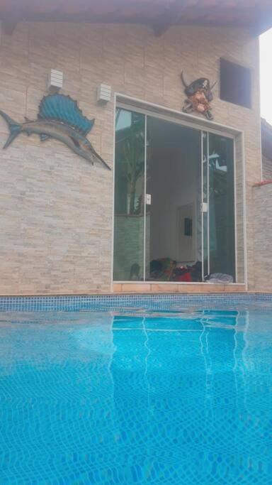 Casa com Piscina Aquecida e Ar Condicionado