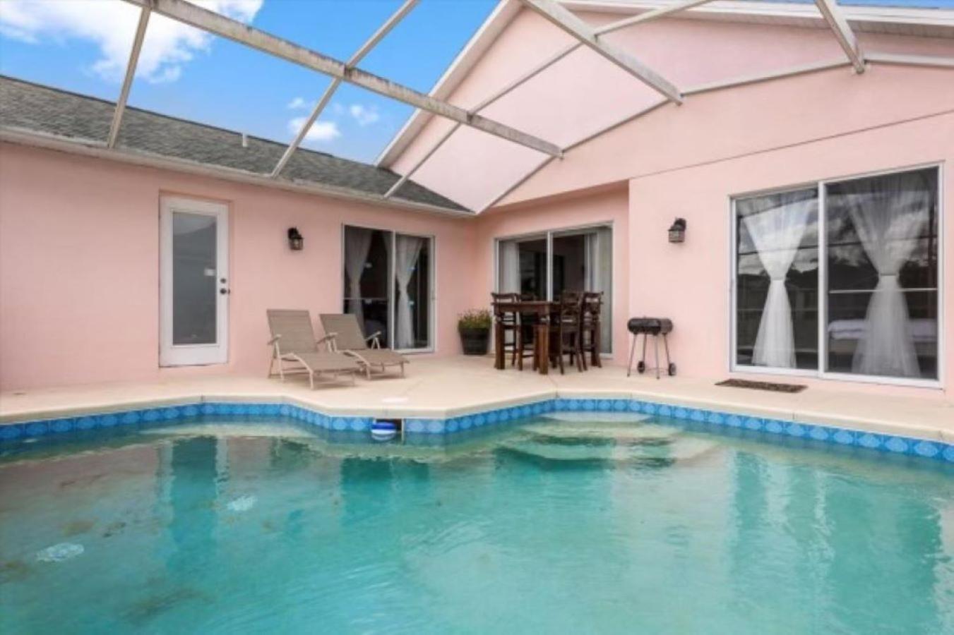 Welcome home to this beautiful 4 bdrm house with heated pool minutes away from Disney and Universal Parks. view 3