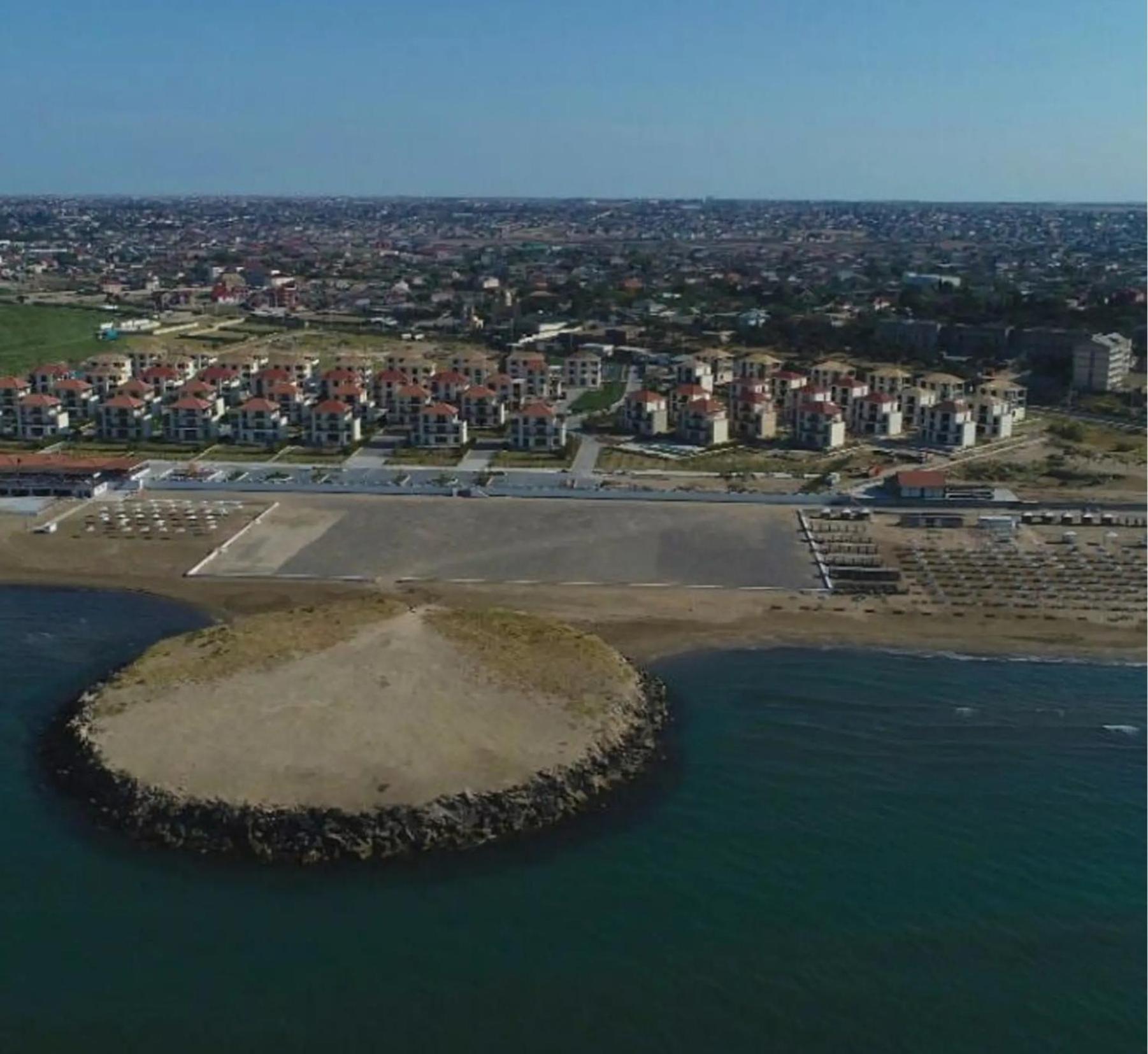 S Pollo Apartments by first beach line