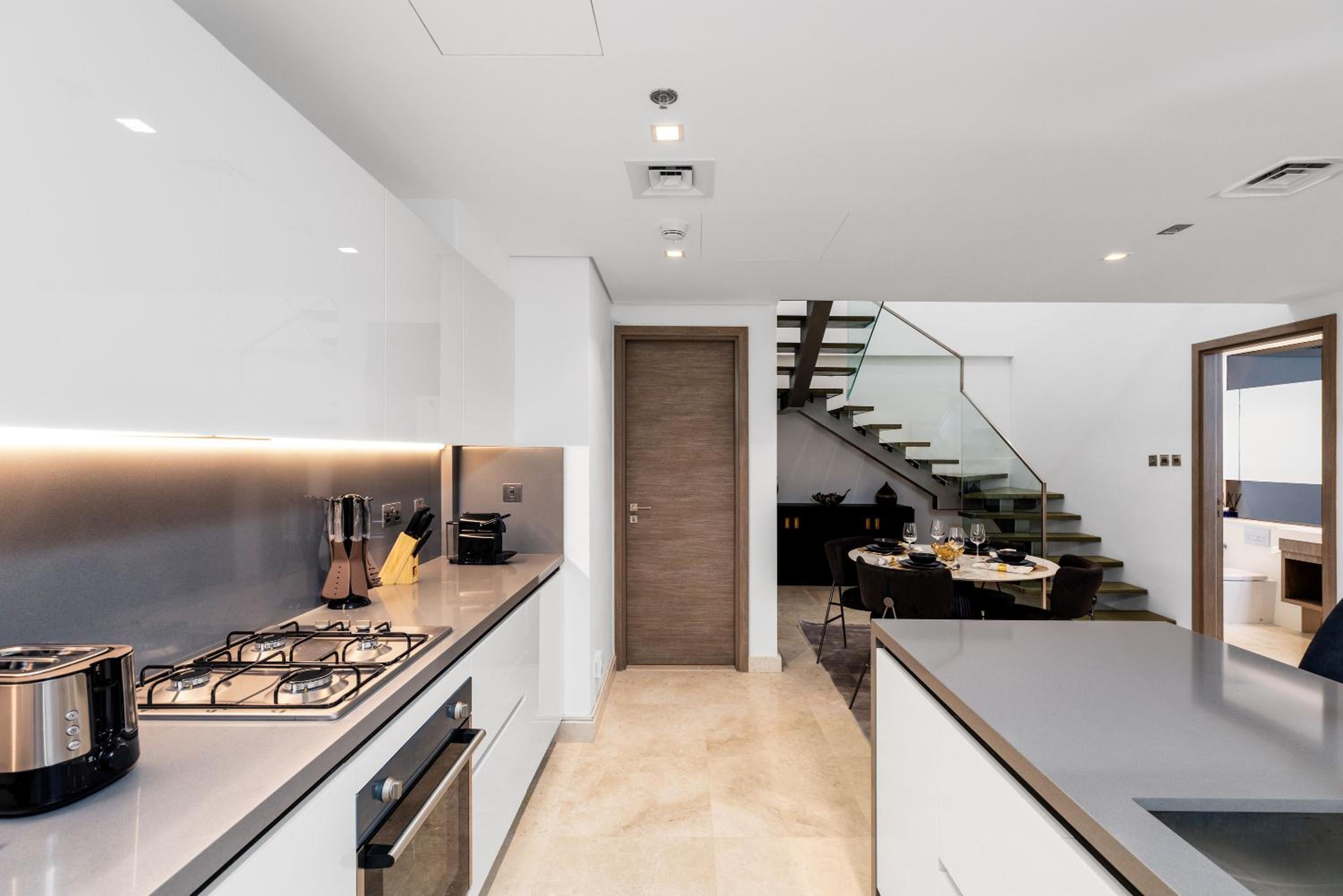 Maison Privee - Exquisite Duplex with Private Patio & Loft Living