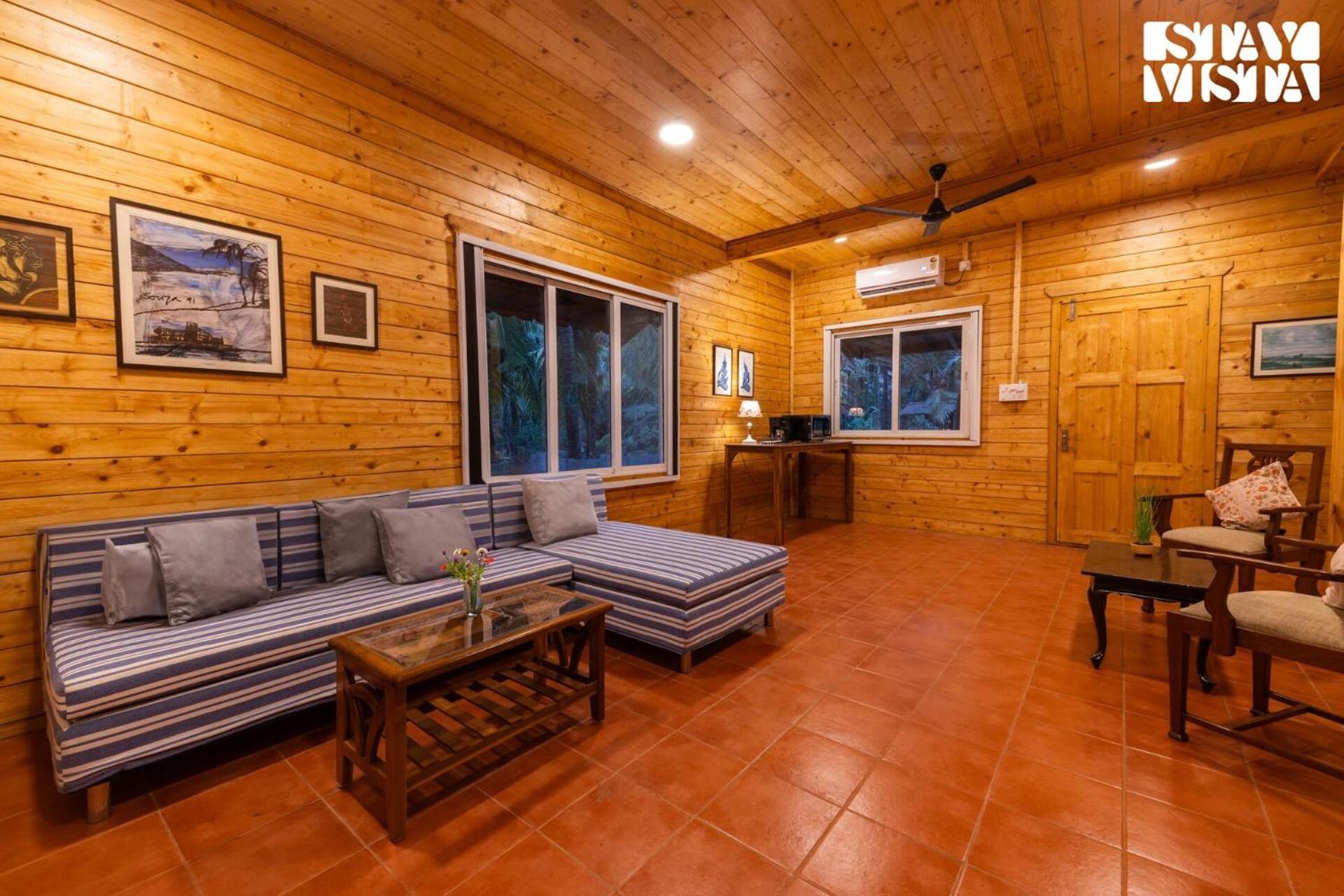 Serene Seaside Chalet by StayVista - Wooden retreat near Nagaon Beach