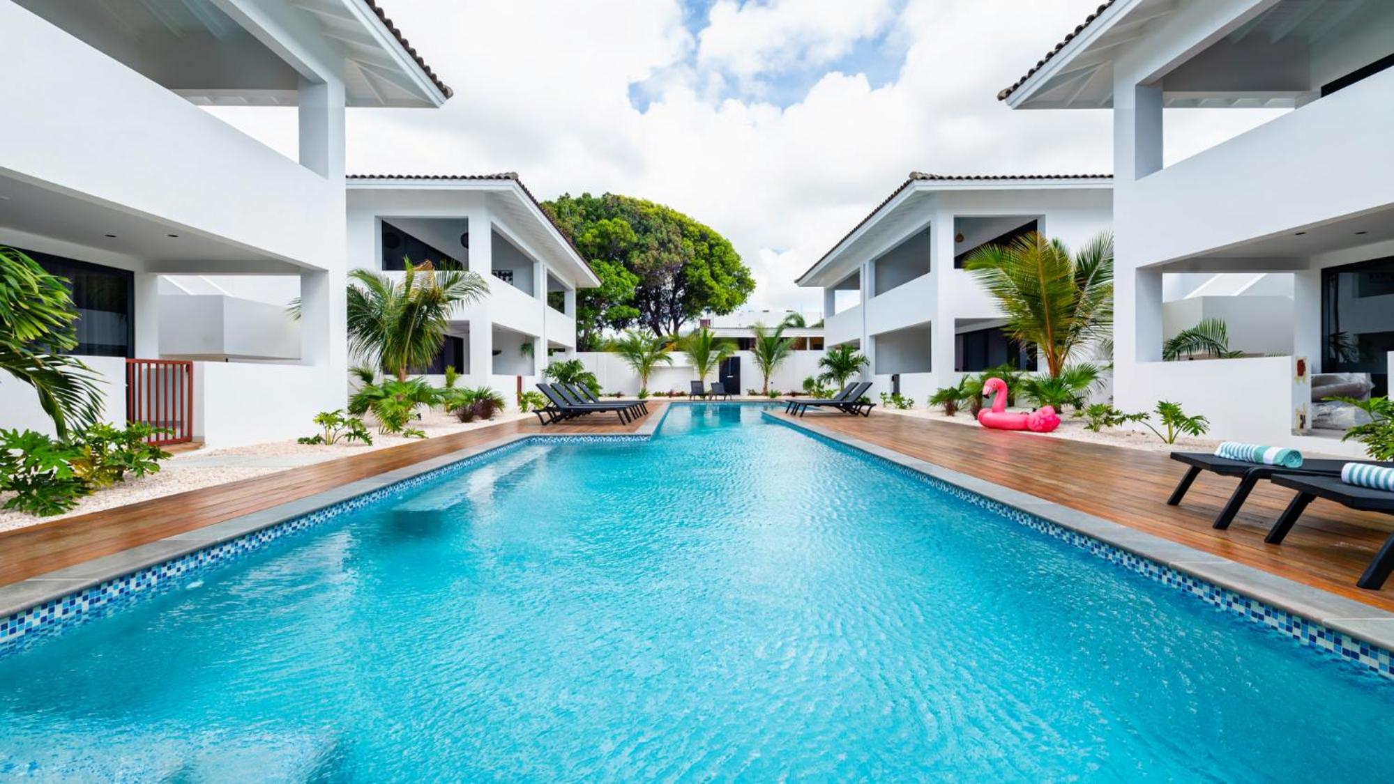 Palm Suite - Newly constructed poolside apartment just minutes from the beach