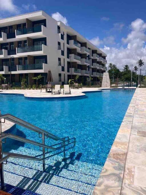 Resort em Porto de Galinhas- Flat Térreo Frente Piscinas- Muro Alto-B18