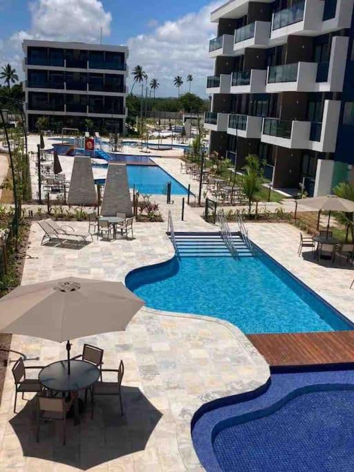 Resort em Porto de Galinhas- Flat Térreo Frente Piscinas- Muro Alto-B18