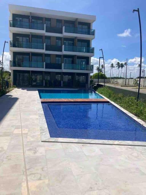 Resort em Porto de Galinhas- Flat Térreo Frente Piscinas- Muro Alto-B18