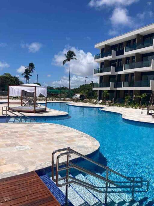 Resort em Porto de Galinhas- Flat Térreo Frente Piscinas- Muro Alto-B18