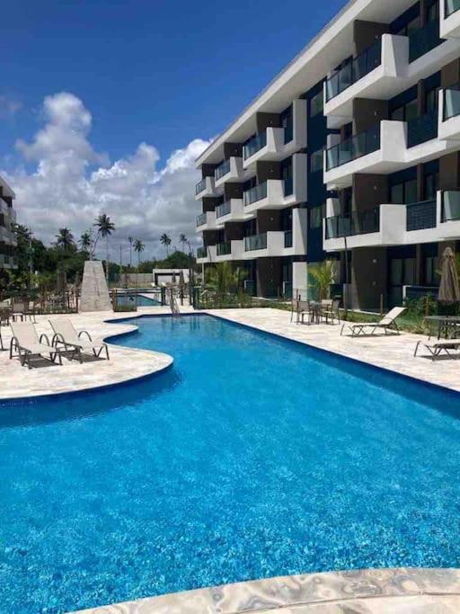 Resort em Porto de Galinhas- Flat Térreo Frente Piscinas- Muro Alto-B18