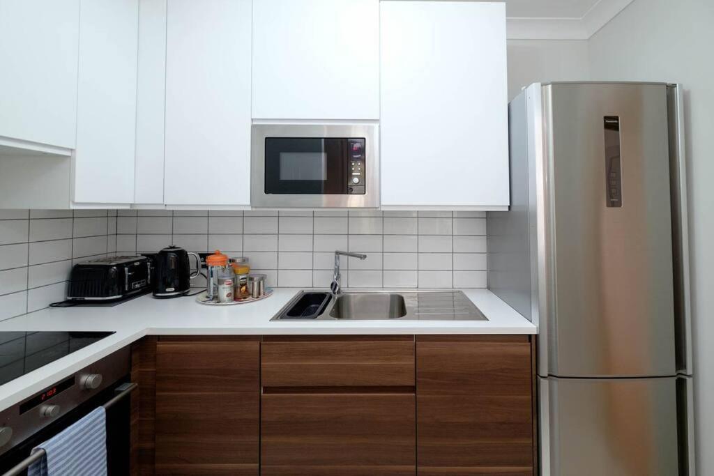 Stunning First Avenue balcony flat moments from the beach!