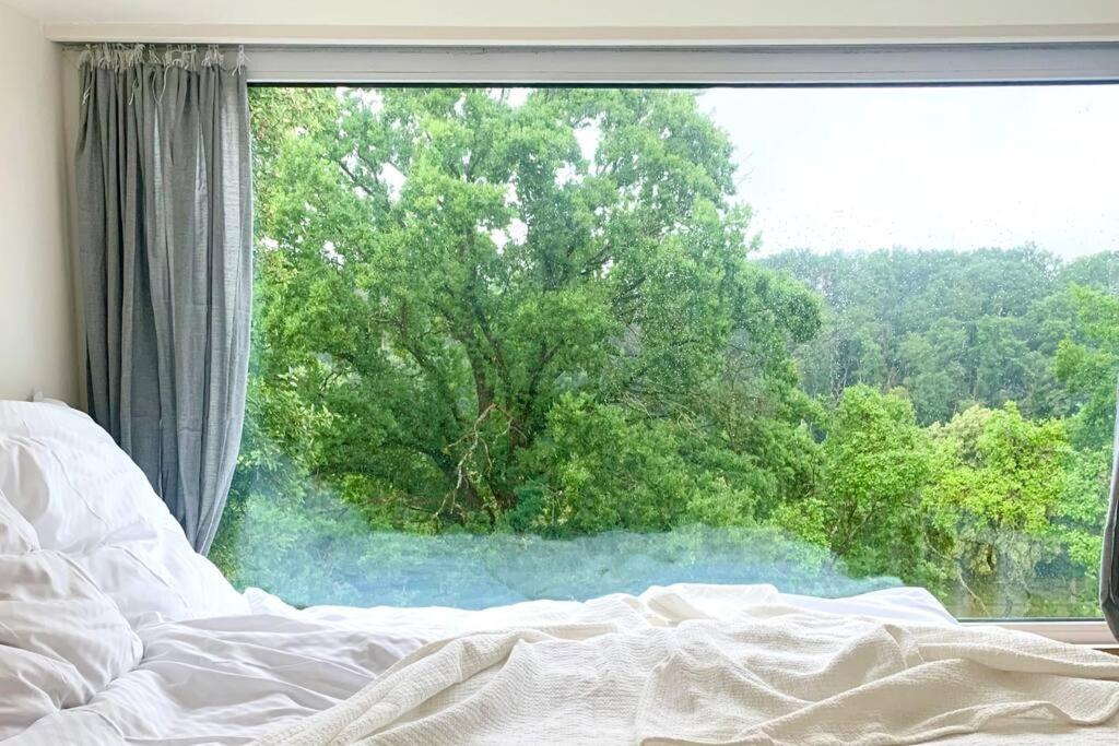 Tinyhouse Minimalus Panorama Schlafloft im Grünen
