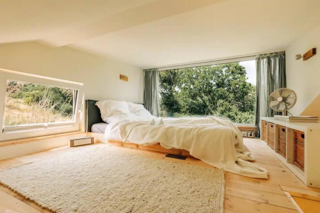 Tinyhouse Minimalus Panorama Schlafloft im Grünen