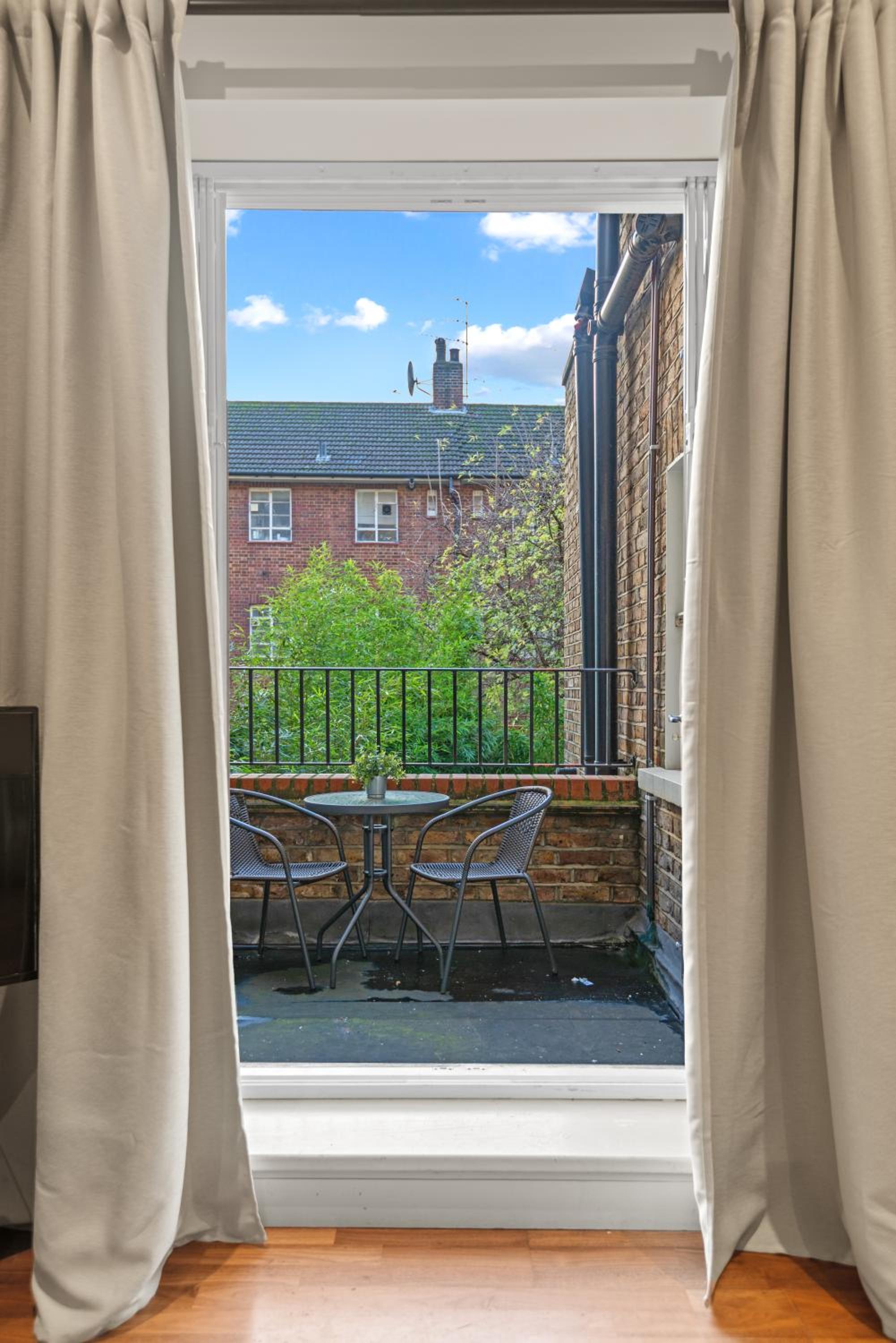 Notting Hill: Stylish 1BR with Terrace - Suite Inn