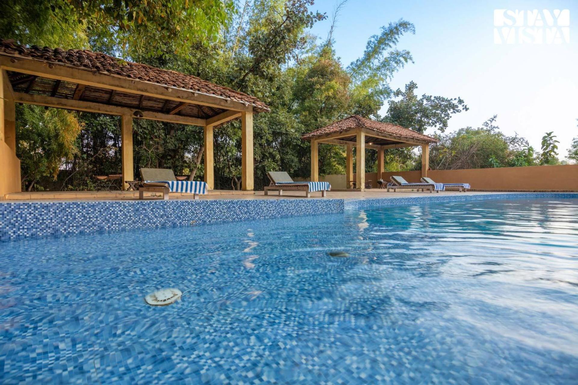 StayVista's Rustic Respite - Hillside Retreat near Tala Gate with Swimming Pool, Lawn & Indoor-Outdoor Games view 5