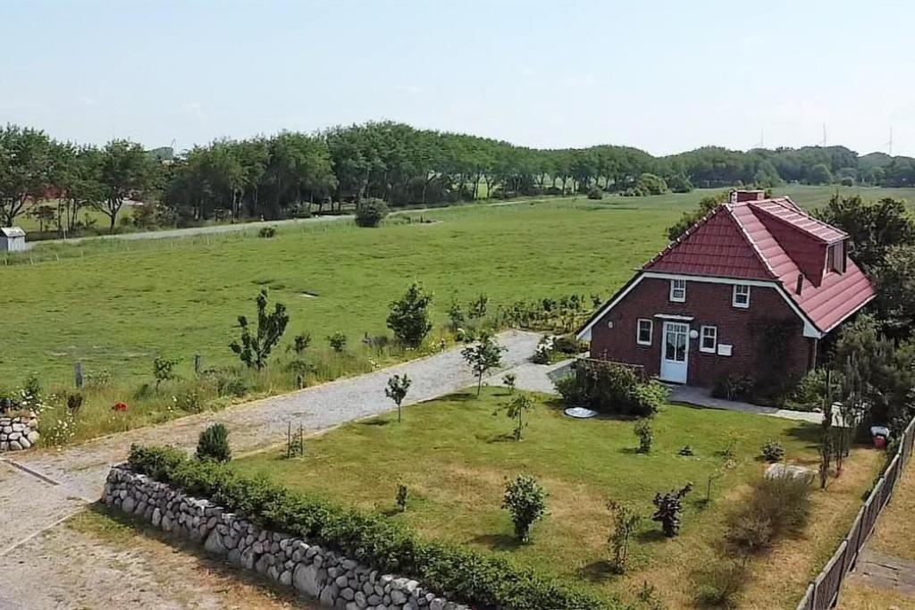 Haus Benninghusumer Deichweg, eingezäunt, Hunde Willkommen, Kamin, ruhig gelegen, WLAN