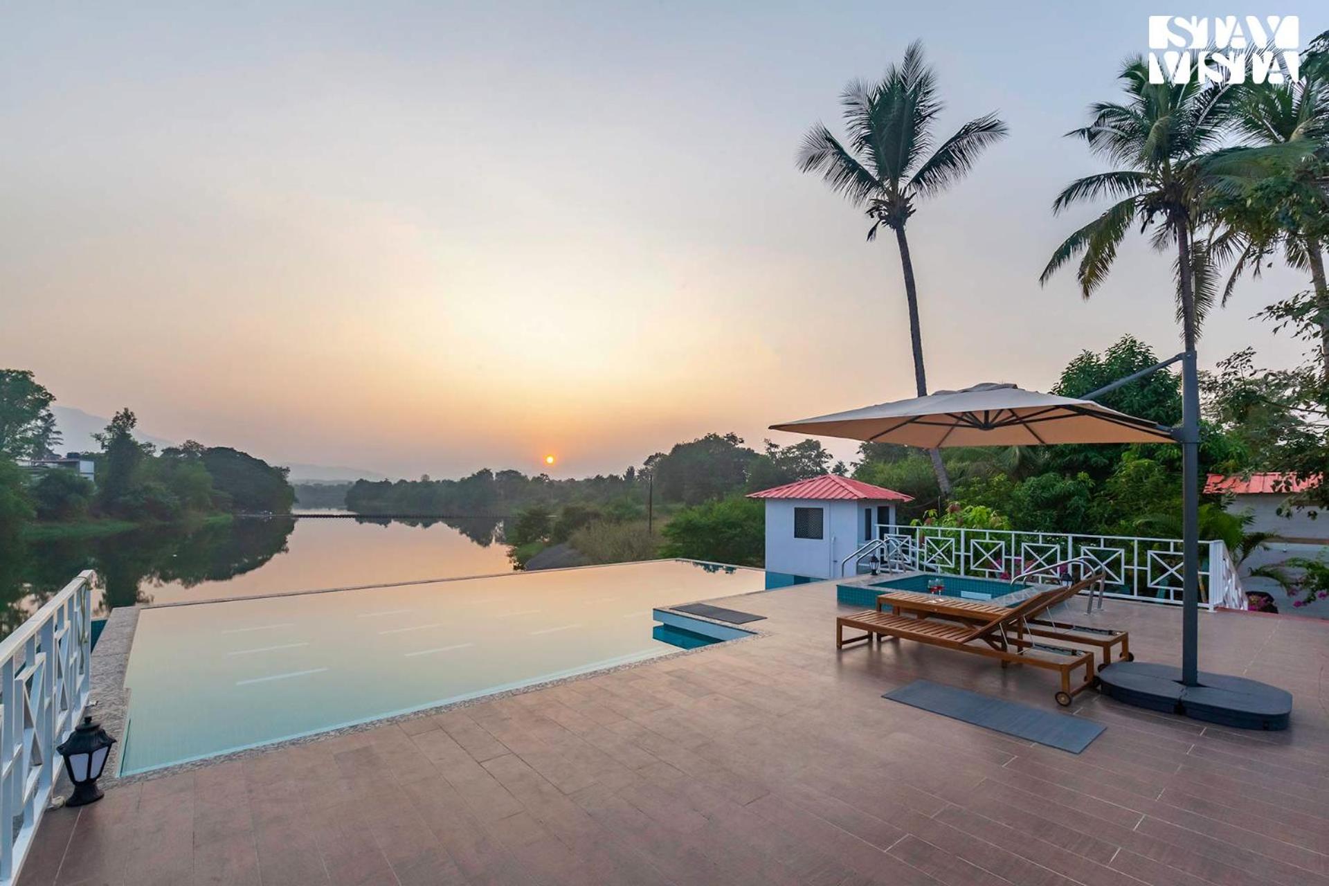 StayVista's Waterway Retreat - Lakeside Oasis with Infinity Pool