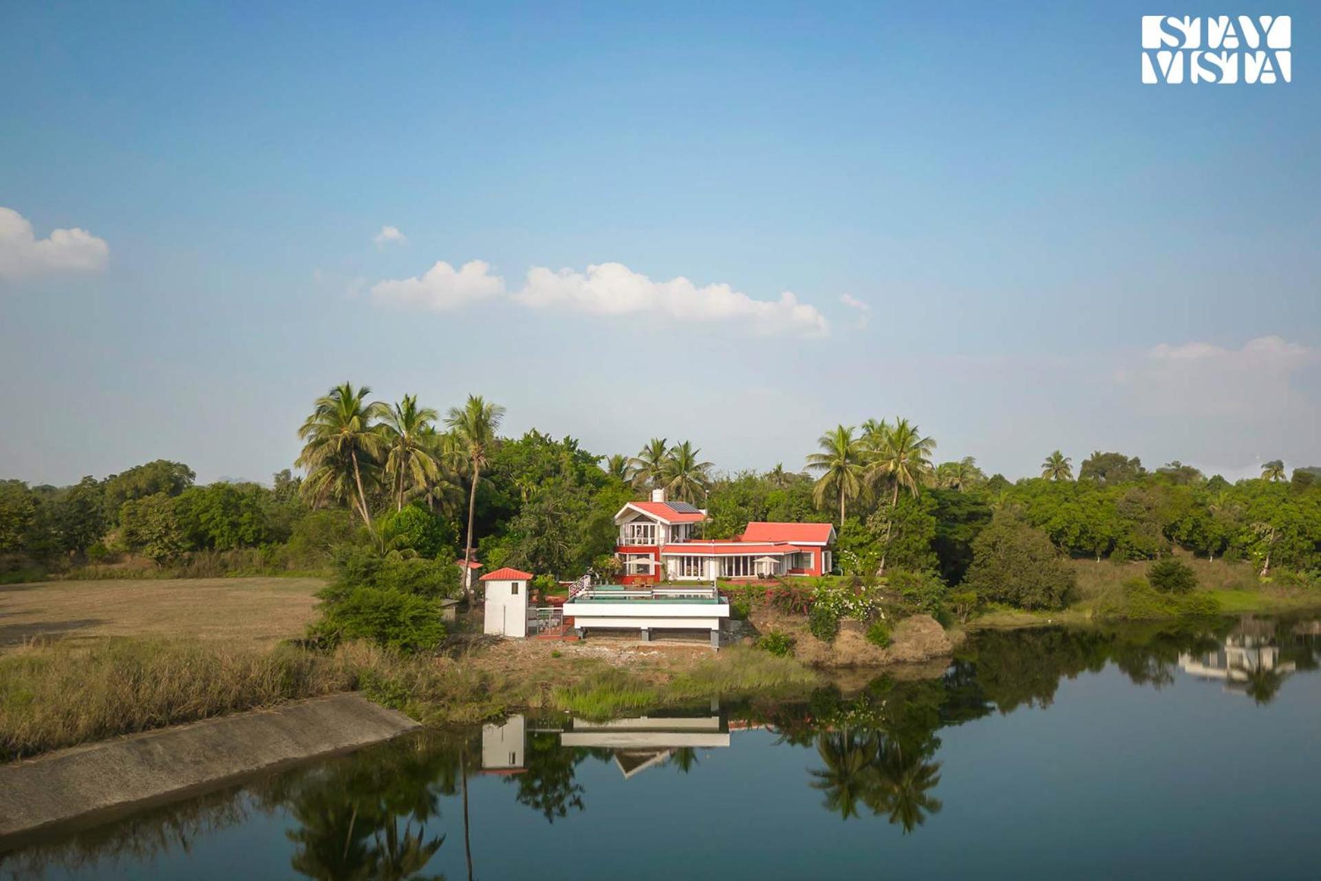 StayVista's Waterway Retreat - Lakeside Oasis with Infinity Pool